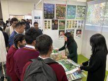 School Students collect some posters and pamphlets from the Board during the Exhibition