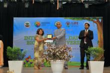 Shri. R S Gill, IFS PCCF & HoFF giving the prize to the teacher of Shillong College 