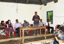 Mr. Lamo, Gram Sevak Of addressing the village elders at the Awareness Programme on BMC